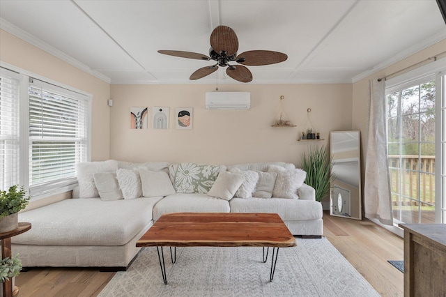 living room featuring an AC wall unit, a ceiling fan, light wood-style flooring, and crown molding