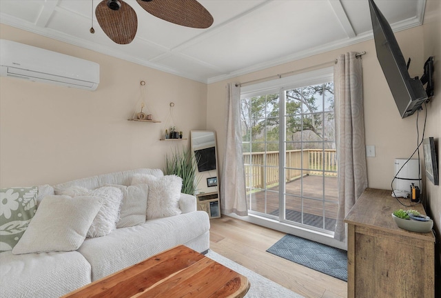 living room with an AC wall unit, wood finished floors, crown molding, and a ceiling fan