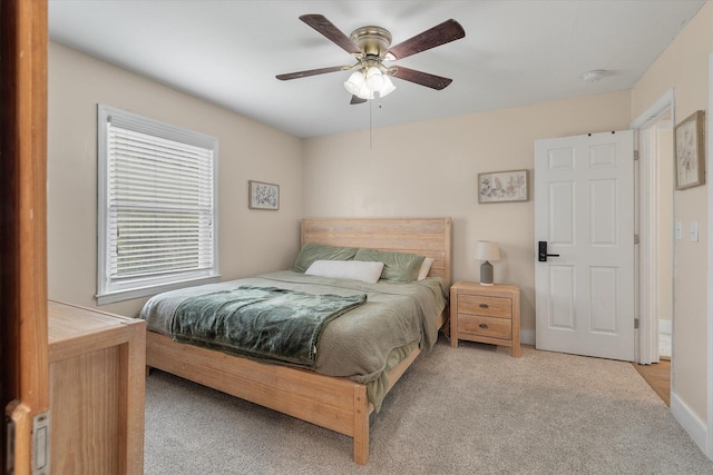 bedroom with light colored carpet and ceiling fan