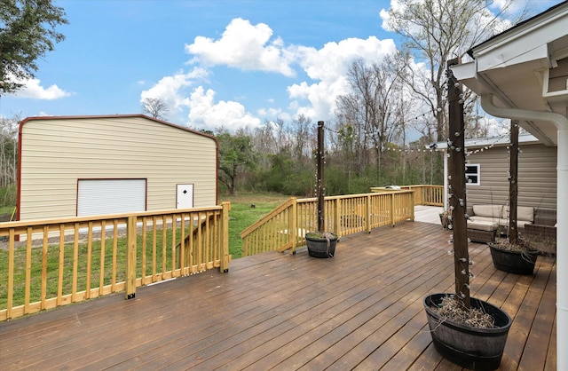 wooden deck featuring a detached garage