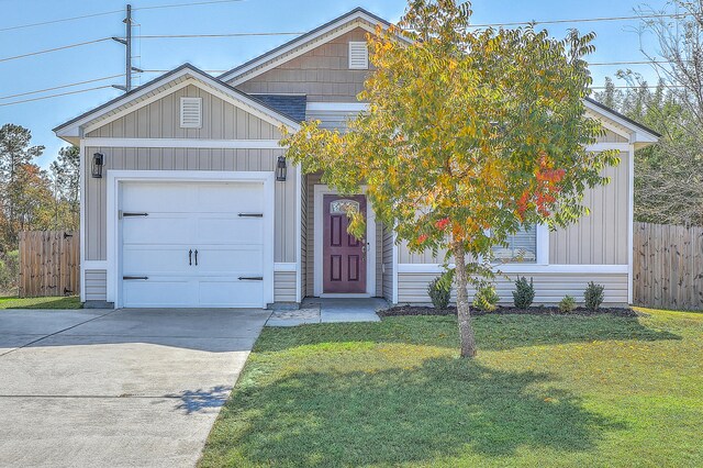 view of front facade featuring a garage and a front lawn