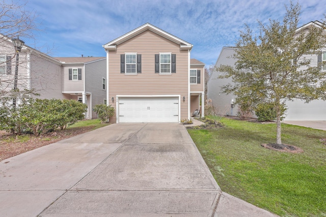 view of front facade with an attached garage, concrete driveway, and a front yard