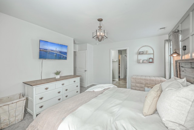 bedroom featuring an inviting chandelier and visible vents