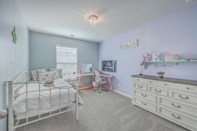 carpeted bedroom featuring baseboards and visible vents