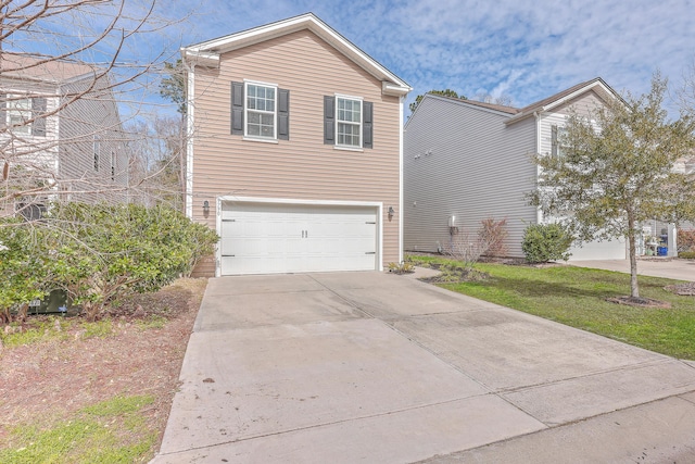 view of front of property with a garage and concrete driveway