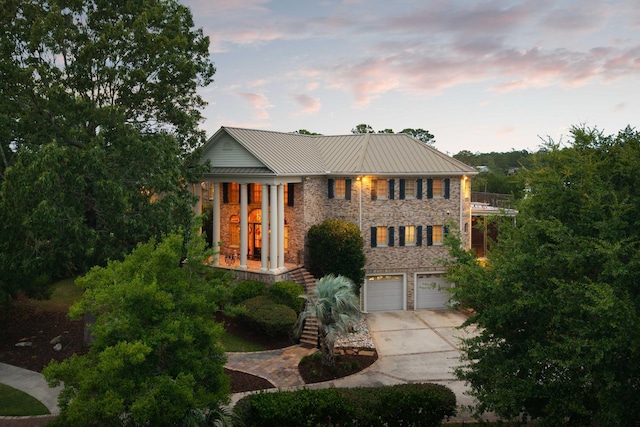 2834 Parkers Landing Rd, Mount Pleasant, SC 29466 - view of front of house featuring driveway, stone siding, an attached garage, a balcony, and stairway