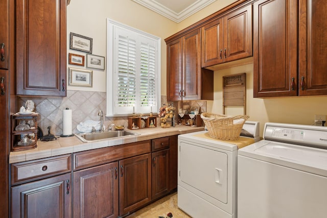2834 Parkers Landing Rd, Mount Pleasant, SC 29466 - laundry area with cabinet space, washing machine and clothes dryer, and crown molding