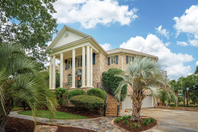 2834 Parkers Landing Rd, Mount Pleasant, SC 29466 - greek revival house featuring driveway, stairway, a garage, a porch, and brick siding