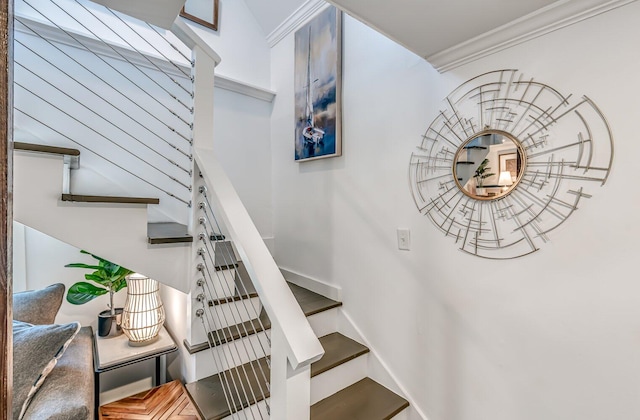 staircase with ornamental molding