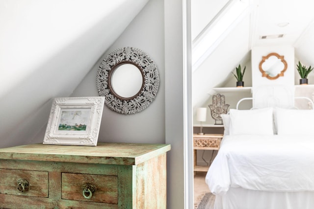 bedroom featuring lofted ceiling