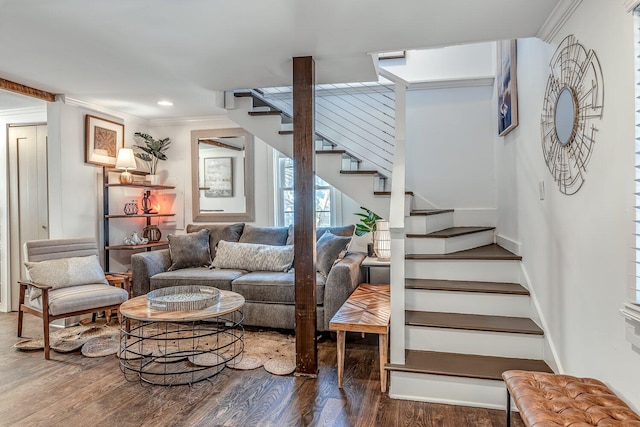 living room with hardwood / wood-style floors and ornamental molding