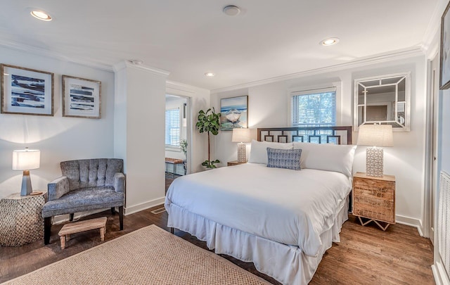 bedroom featuring wood-type flooring and crown molding