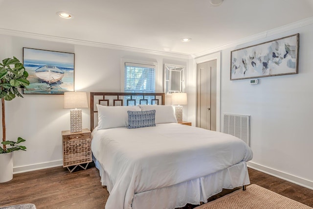 bedroom with crown molding and dark wood-type flooring