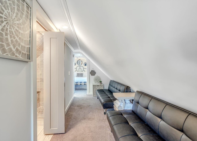 carpeted living room featuring crown molding and vaulted ceiling