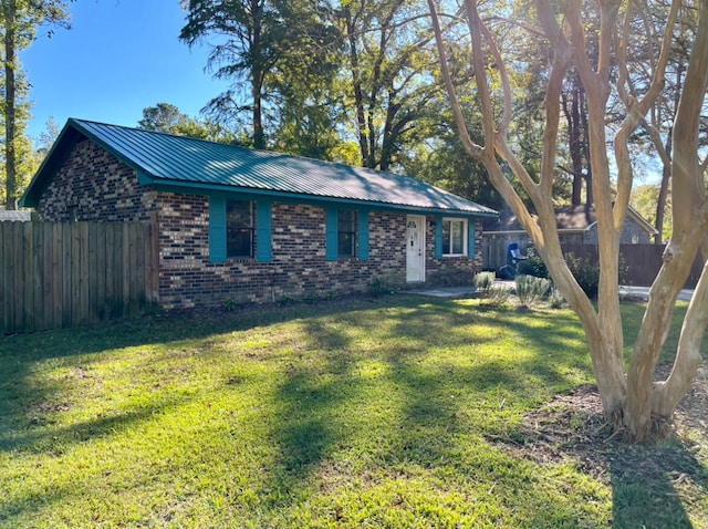 ranch-style house with a front yard