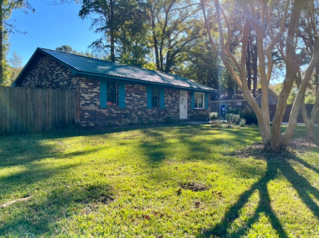 ranch-style house with a front lawn