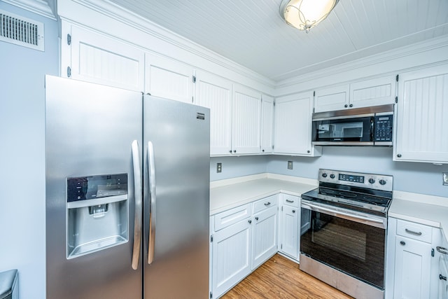 kitchen featuring white cabinetry, light hardwood / wood-style floors, stainless steel appliances, and crown molding