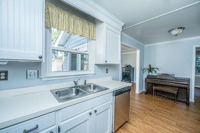 kitchen featuring dishwasher, sink, crown molding, light wood-type flooring, and white cabinets