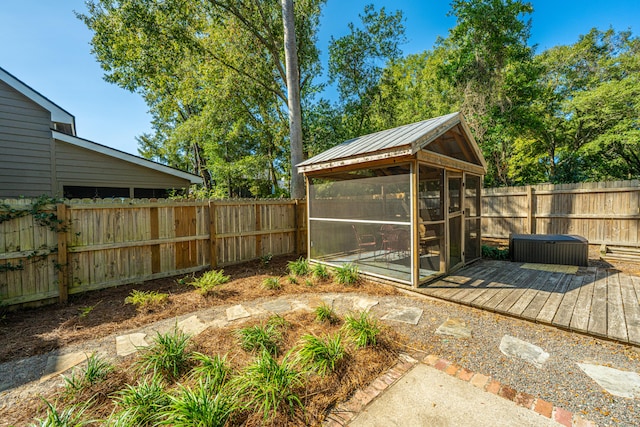 wooden deck with a sunroom