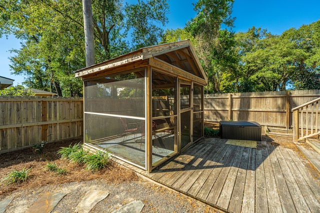 wooden terrace featuring a sunroom