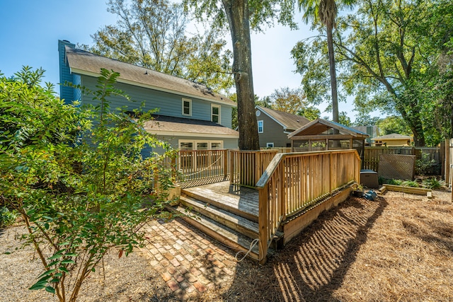 back of house featuring a deck