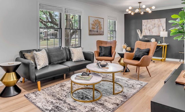 living room with a chandelier, wood finished floors, ornamental molding, and baseboards