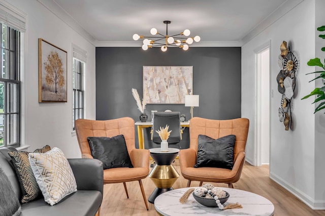 living area with a chandelier, wood finished floors, ornamental molding, and baseboards