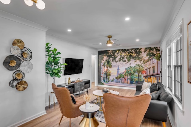living area featuring ornamental molding, wood finished floors, recessed lighting, baseboards, and ceiling fan