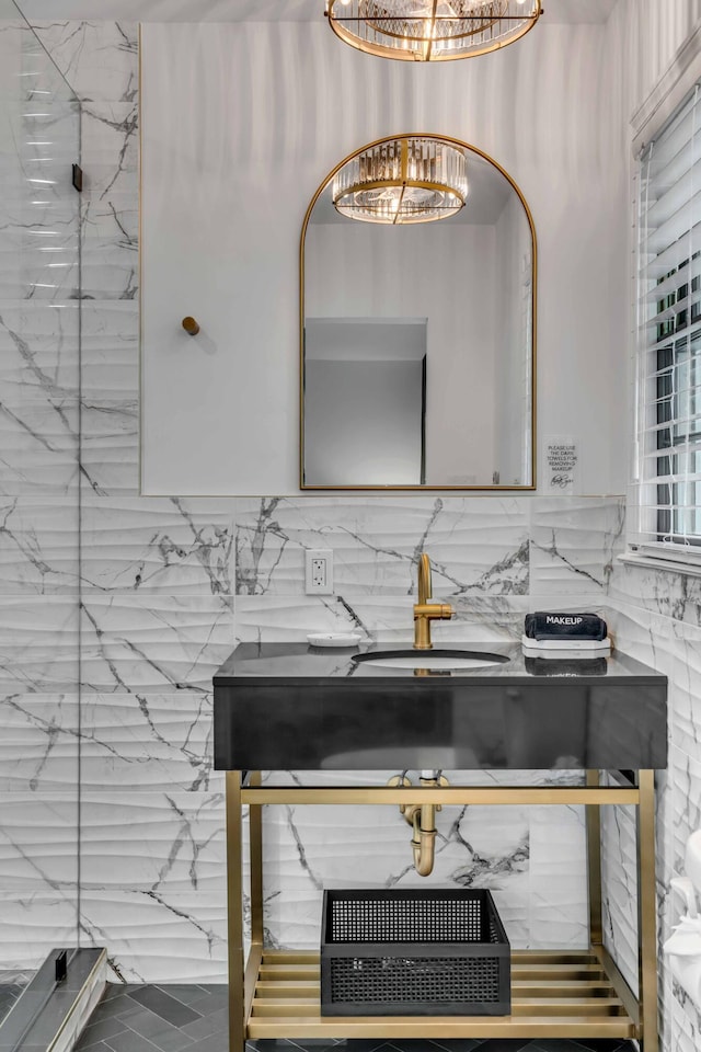 bathroom with a chandelier and vanity