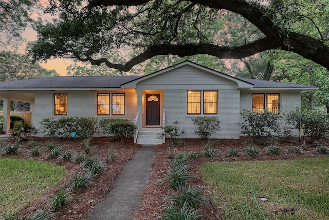 view of front of property featuring brick siding