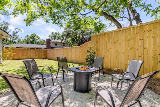 view of patio / terrace with an outdoor fire pit