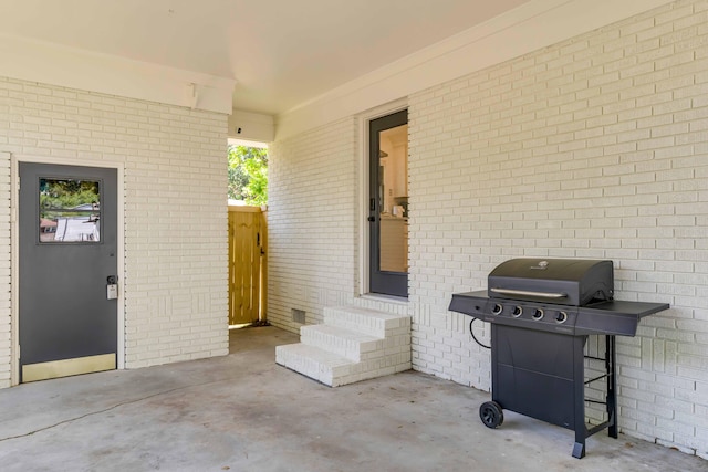 view of patio with entry steps and grilling area