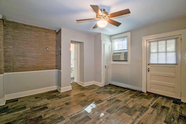 foyer entrance with cooling unit, dark wood-style floors, baseboards, and ceiling fan