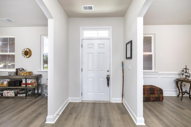 409 Pine Lake Ct, Manning, SC 29102 - entryway featuring arched walkways, wood finished floors, and baseboards