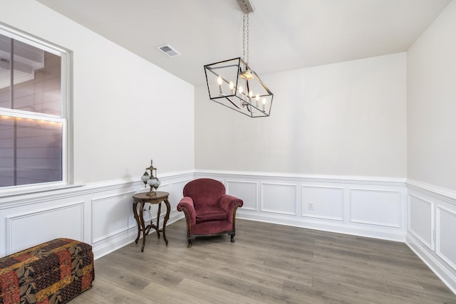 409 Pine Lake Ct, Manning, SC 29102 - sitting room with a chandelier, wainscoting, wood finished floors, and a decorative wall