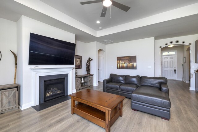 409 Pine Lake Ct, Manning, SC 29102 - living area featuring arched walkways, ceiling fan, wood finished floors, a fireplace, and recessed lighting
