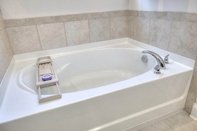 409 Pine Lake Ct, Manning, SC 29102 - bathroom with a bath and tile patterned flooring