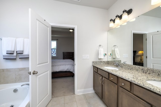 409 Pine Lake Ct, Manning, SC 29102 - full bathroom with ensuite bath, double vanity, tile patterned flooring, a bath, and baseboards