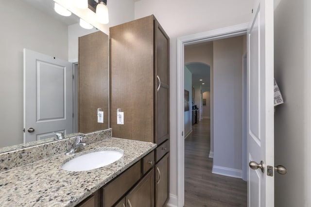 409 Pine Lake Ct, Manning, SC 29102 - bathroom featuring vanity, baseboards, and wood finished floors