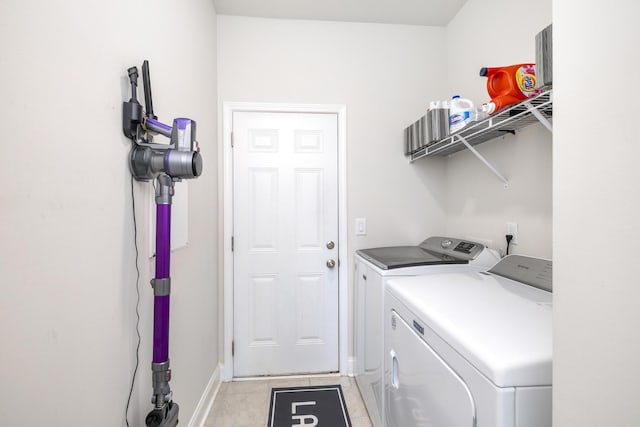 409 Pine Lake Ct, Manning, SC 29102 - washroom featuring washer and clothes dryer, light tile patterned floors, and baseboards
