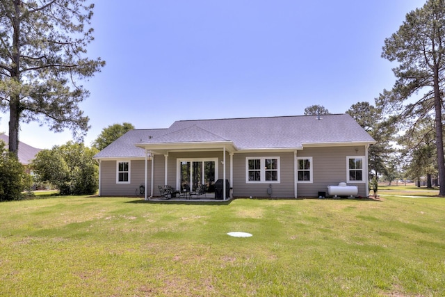 409 Pine Lake Ct, Manning, SC 29102 - rear view of house featuring a yard, a patio area, and a shingled roof