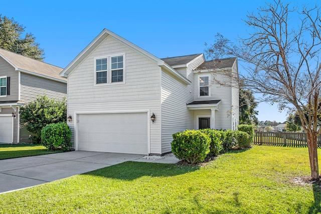 view of front of property with a garage and a front lawn