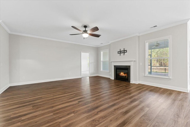 unfurnished living room featuring dark hardwood / wood-style floors, ceiling fan, and crown molding