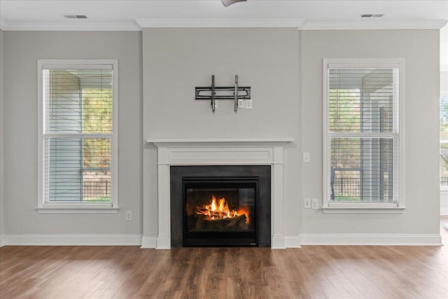 interior details featuring hardwood / wood-style flooring and crown molding