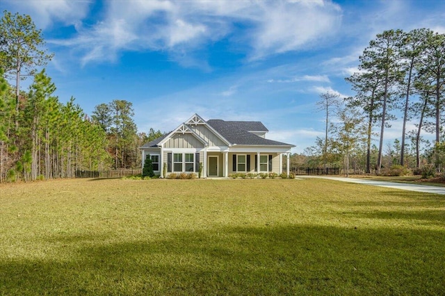 view of front of property featuring a front lawn and covered porch