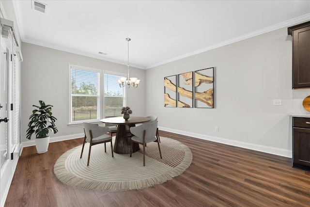 dining room featuring a notable chandelier, dark hardwood / wood-style floors, and crown molding