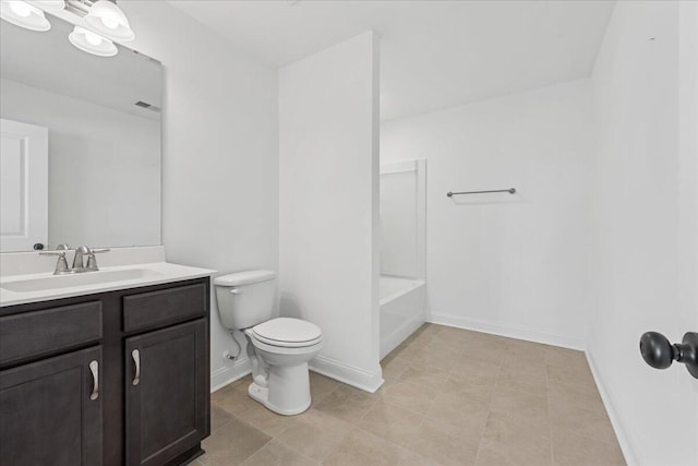 bathroom featuring tile patterned floors, vanity, and toilet