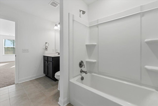 full bathroom with washtub / shower combination, tile patterned floors, vanity, and toilet