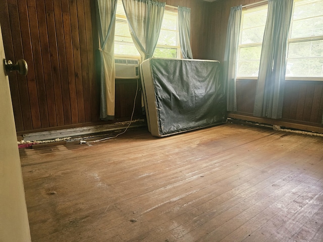 8719 Jefferies Hwy, Walterboro, SC 29488 - unfurnished room featuring wood-type flooring, cooling unit, and wood walls