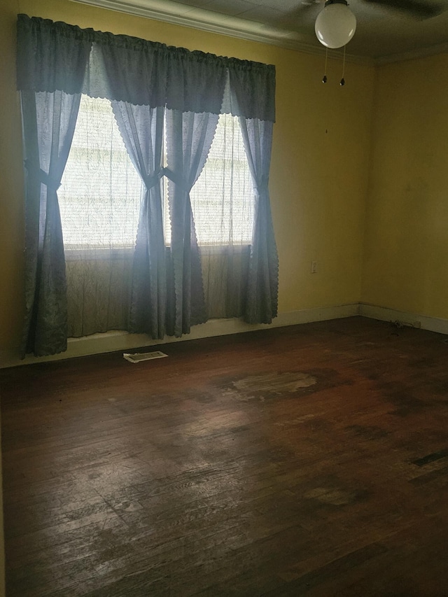 8719 Jefferies Hwy, Walterboro, SC 29488 - spare room featuring dark wood-style floors, crown molding, and a ceiling fan